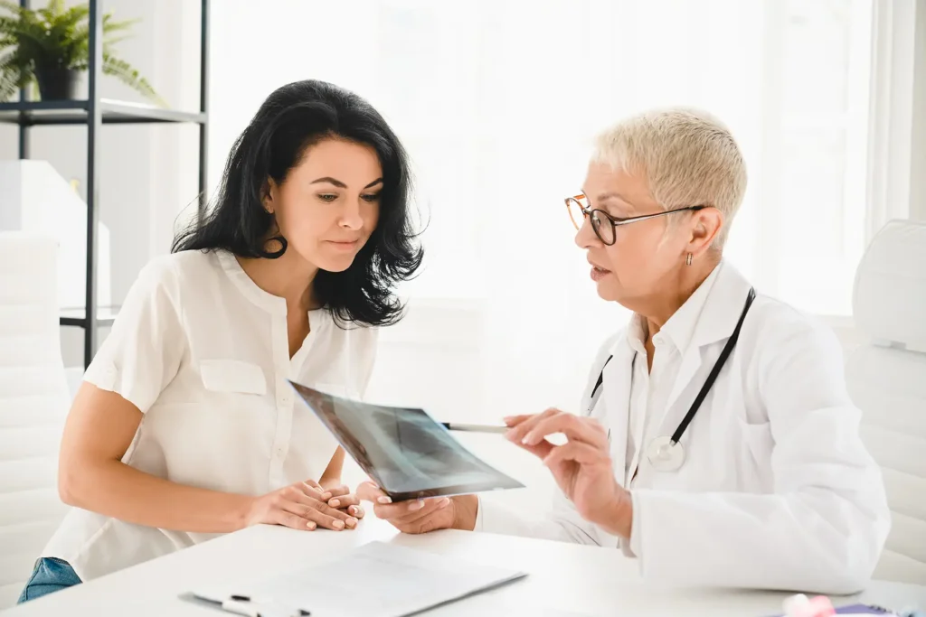 doctor and patient viewing x-ray